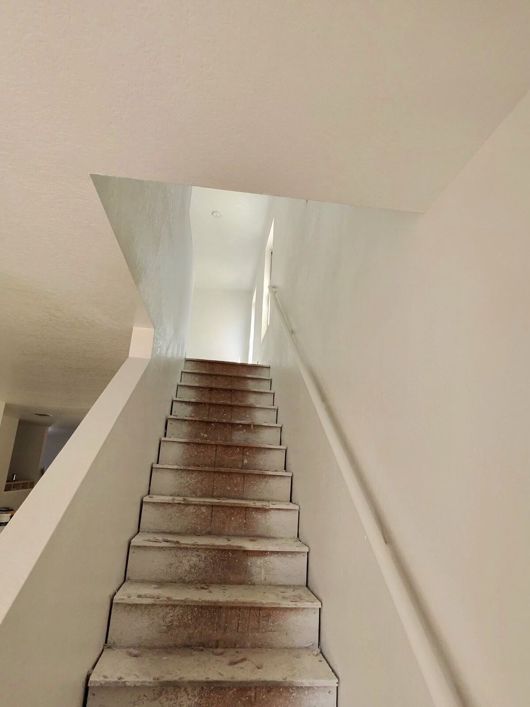 Worn staircase before refinishing